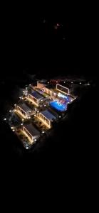 an aerial view of a city at night at Sunheaven resort in Al Qarşā