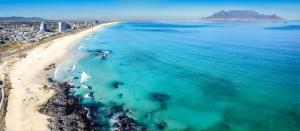 an aerial view of a beach and the ocean at Beach Vibes Villa in Cape Town