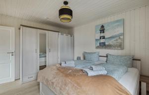 En eller flere senge i et værelse på Ferienhaus Skipper