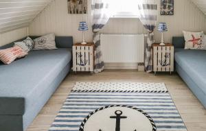 a room with two beds and a rug on the floor at Haus Ankerplatz in Wandlitz