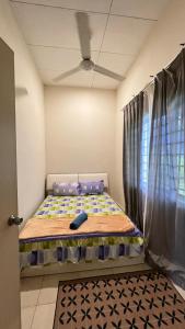 Postel nebo postele na pokoji v ubytování Ct Ruby homestay