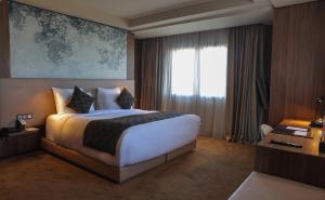 a hotel room with a large bed and a window at Villa Blanca Urban Hotel in Casablanca +53 photos