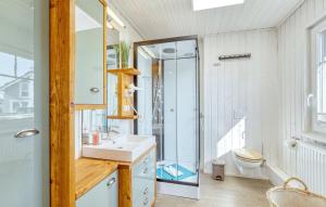 a bathroom with a sink and a shower and a toilet at Haus Feldblick in Wandlitz