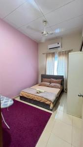 Postel nebo postele na pokoji v ubytování Ct Ruby homestay