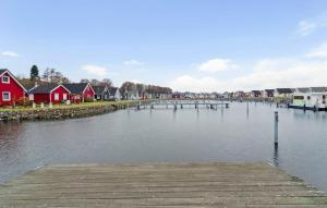 a view of a river with houses and a dock at Haus Hafen Liebe in Wandlitz