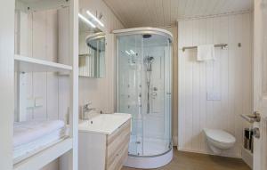 a bathroom with a shower and a sink and a toilet at Haus Hafen Liebe in Wandlitz