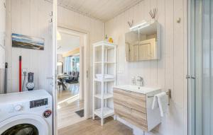 a bathroom with a sink and a washing machine at Haus Hafen Liebe in Wandlitz +13 photos