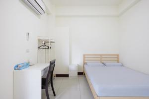 Postel nebo postele na pokoji v ubytování 谷香 Guxiang House 東區靜巷透天獨棟 + 16 fotografií