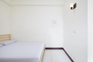 Postel nebo postele na pokoji v ubytování 谷香 Guxiang House 東區靜巷透天獨棟