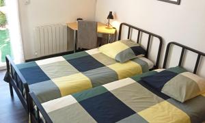 Ένα ή περισσότερα κρεβάτια σε δωμάτιο στο BonAbri Vacances - Chambres d'hôtes