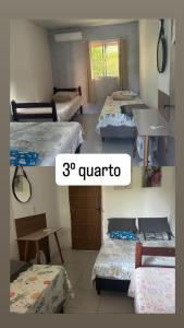 een kamer met drie bedden in een kamer bij casa de campo em Aldeia PE in Recife