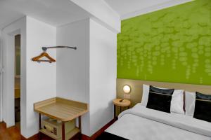 Ένα ή περισσότερα κρεβάτια σε δωμάτιο στο Palette Legian Beach