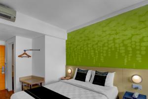 Ένα ή περισσότερα κρεβάτια σε δωμάτιο στο Palette Legian Beach