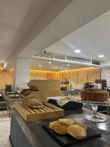 a kitchen with a counter with some bread on it at Alma Candida 02 in Valença