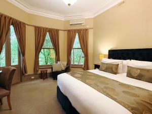 Кровать или кровати в номере Deluxe Villa - Circa 1860s Homestead