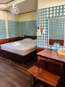 Ένα ή περισσότερα κρεβάτια σε δωμάτιο στο Friendship Guesthouse Dondet