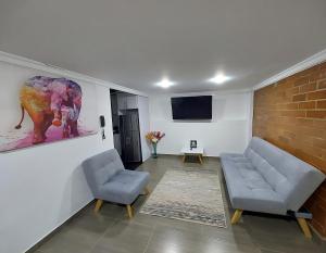 Una televisión o centro de entretenimiento en Apartamento para descansar 2