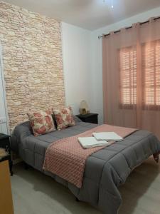 Ένα ή περισσότερα κρεβάτια σε δωμάτιο στο Apartamento Alpe Almagro