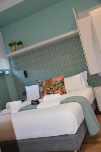 Postel nebo postele na pokoji v ubytování Alma Candida 12