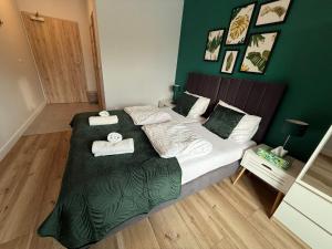 Ένα ή περισσότερα κρεβάτια σε δωμάτιο στο BALTICUS Mrzeżyno