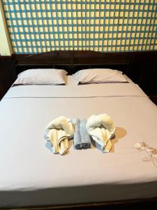 Ένα ή περισσότερα κρεβάτια σε δωμάτιο στο Friendship Guesthouse Dondet