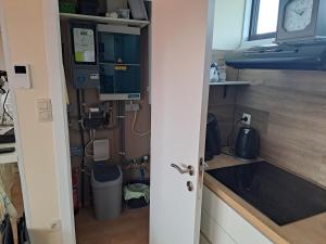 a small kitchen with a sink and a stove at Jonckershof Middelkerke bungalow 26 in Middelkerke
