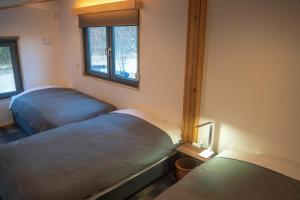 Ένα ή περισσότερα κρεβάτια σε δωμάτιο στο New Field Chalet 白馬