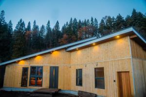 a house with lights on the side of it at New Field Chalet 白馬 in Hakuba