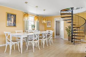 a dining room with a white table and chairs at 193-Vestervig-Vesterhavsvej-36 in Vestervig