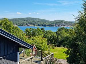 a view of a lake from a house at Lovely view & walking distance to the beach SE09150 in Svanesund