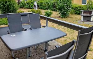 a table and chairs sitting on top of a deck at Amazing Home In Rechlin With Wifi in Rechlin +19 photos