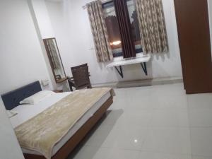 Ένα ή περισσότερα κρεβάτια σε δωμάτιο στο Prakash patel