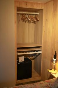 a walk in closet with a keyboard in it at Le Relais d'Hubert in Saint-Hubert +18 photos