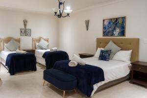 Ένα ή περισσότερα κρεβάτια σε δωμάτιο στο Juliet Rose Luxury Guesthouse B&B