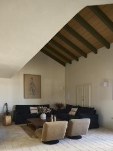 a living room with a couch and a table at Capricho de Doñana in El Rocío