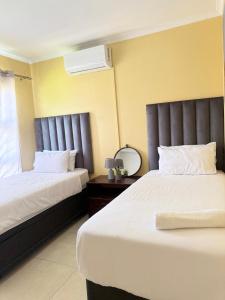 Postel nebo postele na pokoji v ubytování Home@Amalia’s