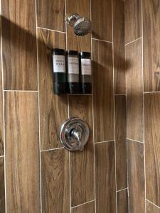 two bottles of wine on a shower door at The Mint Motel in Arlington +56 photos