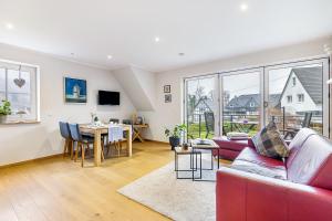 TV a/nebo společenská místnost v ubytování Ferienwohnungen Vogelsang