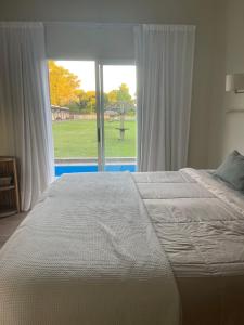 Ένα ή περισσότερα κρεβάτια σε δωμάτιο στο Complejo Bohio