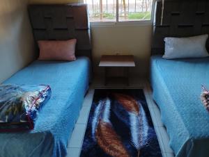 Postel nebo postele na pokoji v ubytování Ain Mzwar Marrakech