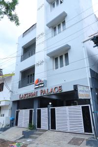 a large white building with a sign that reads laxmi palace at Lakshmi Palace Near Madurai Bus Stand in Madurai