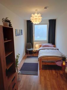 Кровать или кровати в номере Moderne Ferienwohnung am Rennsteig zum Wohlfühlen