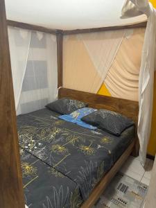 a bunk bed with two pillows on top of it at Maison charmante à Fort-de-France avec équipements modernes in Fort-de-France