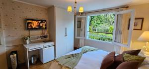 Un pat sau paturi într-o cameră la Pousada Atalaia Premium