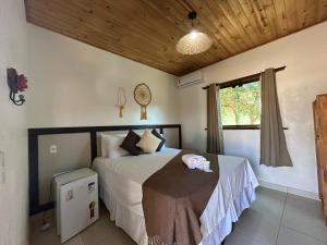 En eller flere senge i et værelse på Pousada Mandalla + 44 billeder