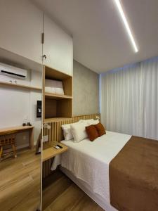 a bedroom with a large bed and a desk at Ipanema Charm and Luxury in Rio de Janeiro +81 photos