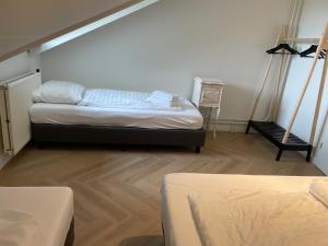 Ένα ή περισσότερα κρεβάτια σε δωμάτιο στο Valley view cottage vlakbij Valkenburg