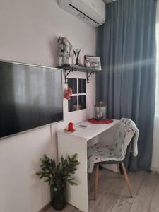 TV a/nebo společenská místnost v ubytování Refugiul Castelului