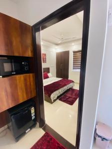 a mirror in a room with a bed and a bedroom at The Winestone Escape in Māripat +23 photos