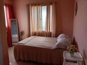 Ένα ή περισσότερα κρεβάτια σε δωμάτιο στο Dona Beba Guesthouse